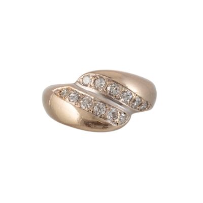 a close up of a gold ring with diamonds on a white background