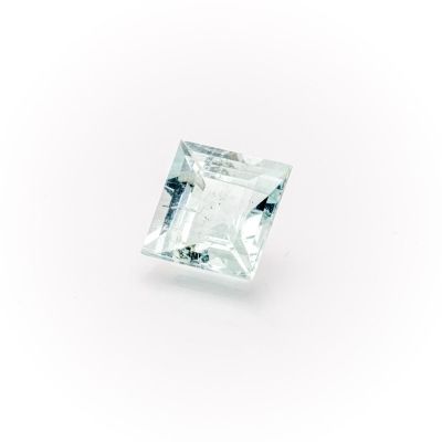 a square cut aquamarinee stone on a white background