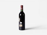 a bottle of wine that is sitting on a table