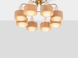 a close up of a light fixture with six lamps on it