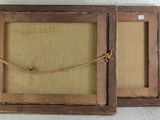 pair of antique wooden picture frames with rope hanging from them