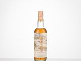 a bottle of whisky sitting on top of a table