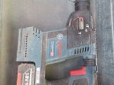 an image of a drill in a box with a cord