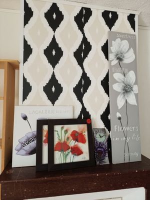a picture of a shelf with pictures and pictures on it