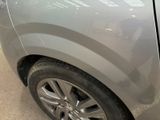 a close up of a car ' s tire with a sticker on it