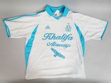 the shirt is white and blue with blue trimmings