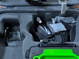 a case with a green handle and a green handle in it