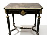 a small table with a marble top on a white background