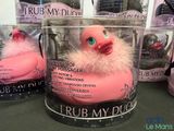 a pink rubber duck that is in a clear container