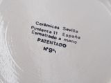 a close up of a white plate with black writing on it