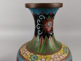 a vase that has a dragon design on it