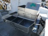 a machine that is sitting on the side of a boat