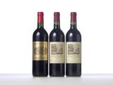 three bottles of wine are lined up on a table