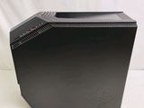 the black desktop computer is sitting on a white surface