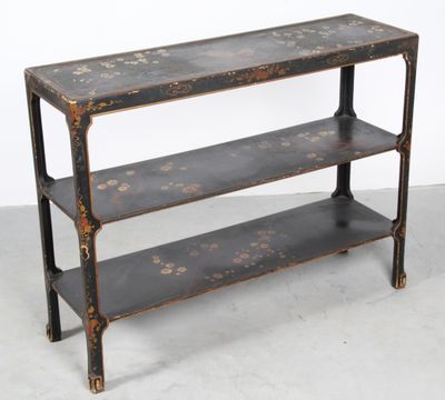 an old wooden shelf with three shelves on top of it