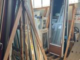 many different types of windows and doors in this room