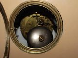 a mirror that has a ball inside of it