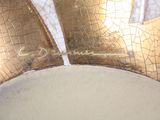 a close up of a gold crown on a white table