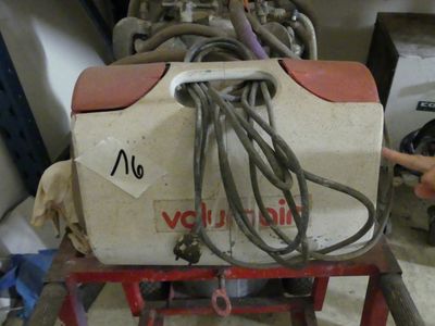 a machine that is sitting on a table in a garage
