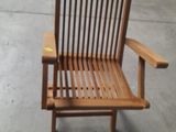 a wooden chair that is sitting in the middle of the floor