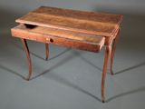 a small wooden desk with a drawer on top of it