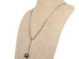 a close up of a mannequin with a necklace on it