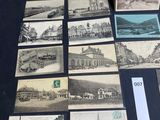 several old black and white photographs of buildings and buildings on a table