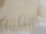 a close up of a piece of white fabric on a table