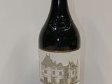 a bottle of wine that is sitting on a table