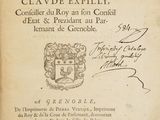 un vieux livre avec l'image d'un blason