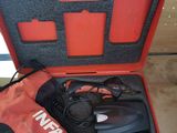 a red case with a pair of gloves and a hair dryer in it