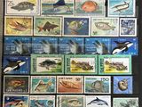 a collection of stamps with different animals and birds on them