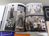 a book with a picture of a woman in a dress and a man in a tuxedo and a man in a tuxed