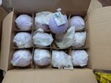 a cardboard box filled with lots of white balls