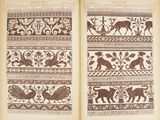an old book with a picture of animals and birds on it