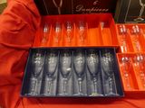 a lot of empty wine glasses in a box