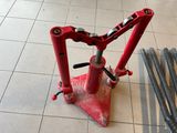 a picture of a red jack stands on a tile floor