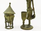 pair of bronze figurines of a woman with a basket and a cup