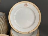 a stack of plates and bowls sitting on a table