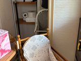 a baby highchair in the corner of a room