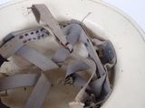 a dirty toilet bowl with a dirty seat and seat belt
