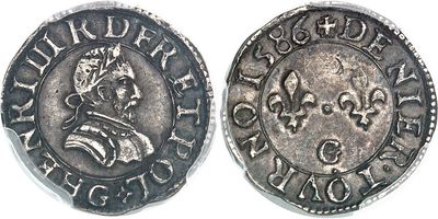 a close up of a coin with an image of a man on it