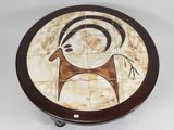 an image of a decorative table with a deer on it