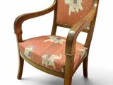 an image of a wooden chair with an orange upholstered upholstered seat