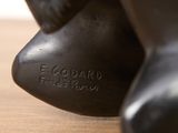 a close up of a statue of a bear on a table