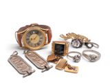 many different types of jewelry on display on a white surface
