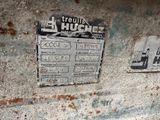 a sign on the side of a building that says it ' s a hutch