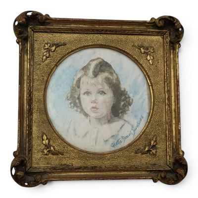 an old picture of a young girl in a gold frame