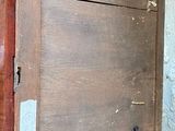 a wooden box that has a black cat on top of it