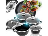 a lot of pots and pans that are on the stove